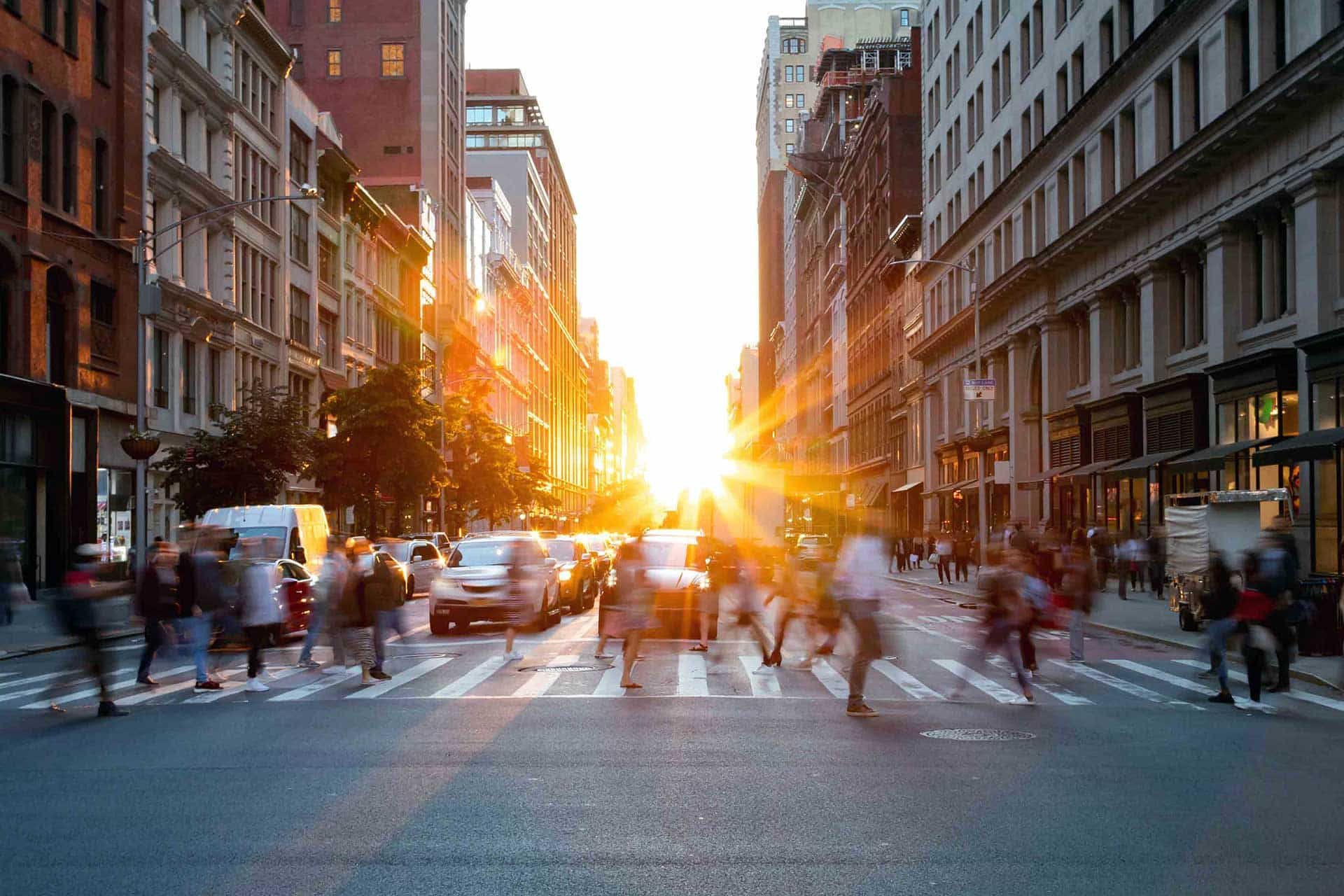 Crowds of busy people walking through the intersection of 5th
Avenue and 23rd Street in Manhattan, New York City